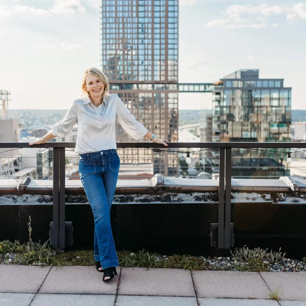 Tracy Pleschourt standing on a rooftop